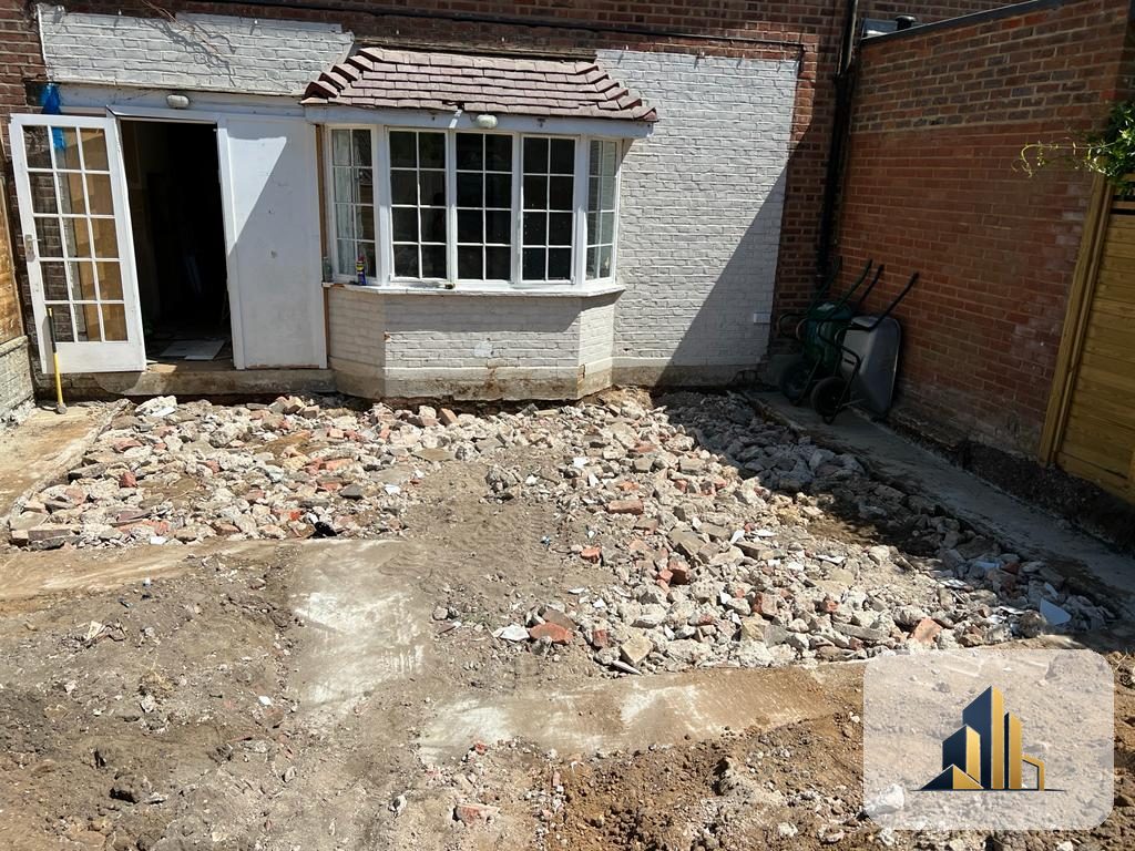 Original rear of a Richmond house with old paving broken out ready for a new extension